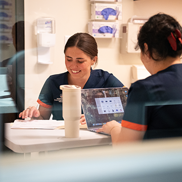 Two SLP students study in a lab