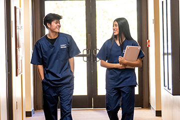 nursing students walking down a hallway