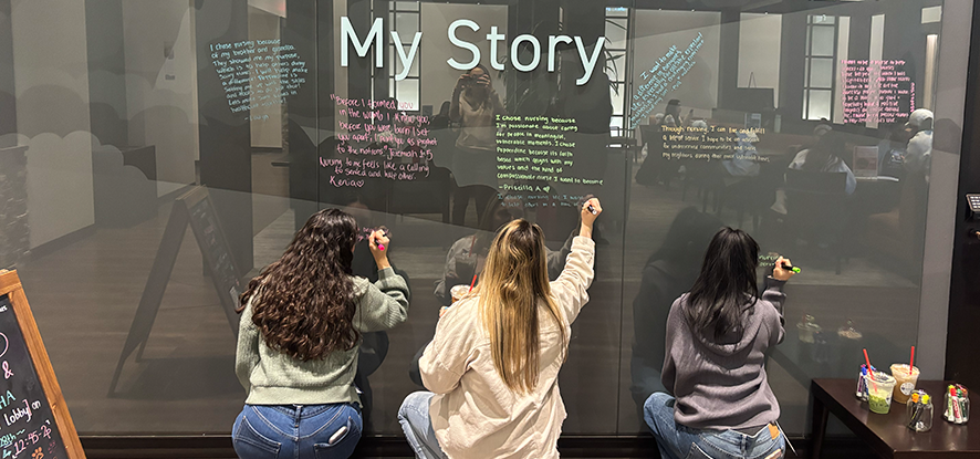 Nursing studnets writing on "My Story" wall