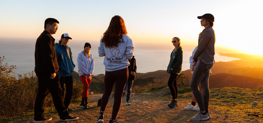 Students on hike during sunset